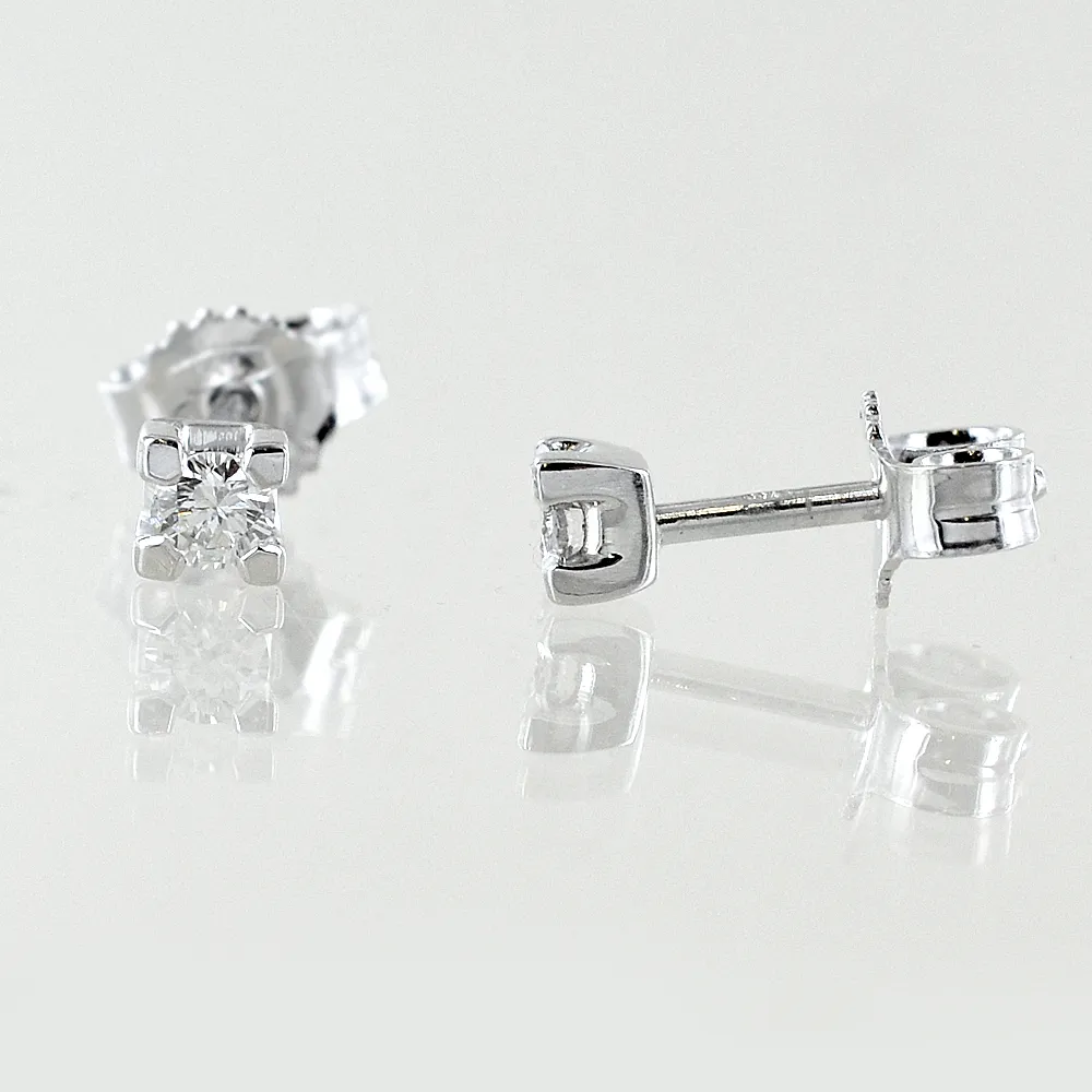 Orecchini punto luce piccoli in oro bianco e diamanti ct. 0.10 G VS1