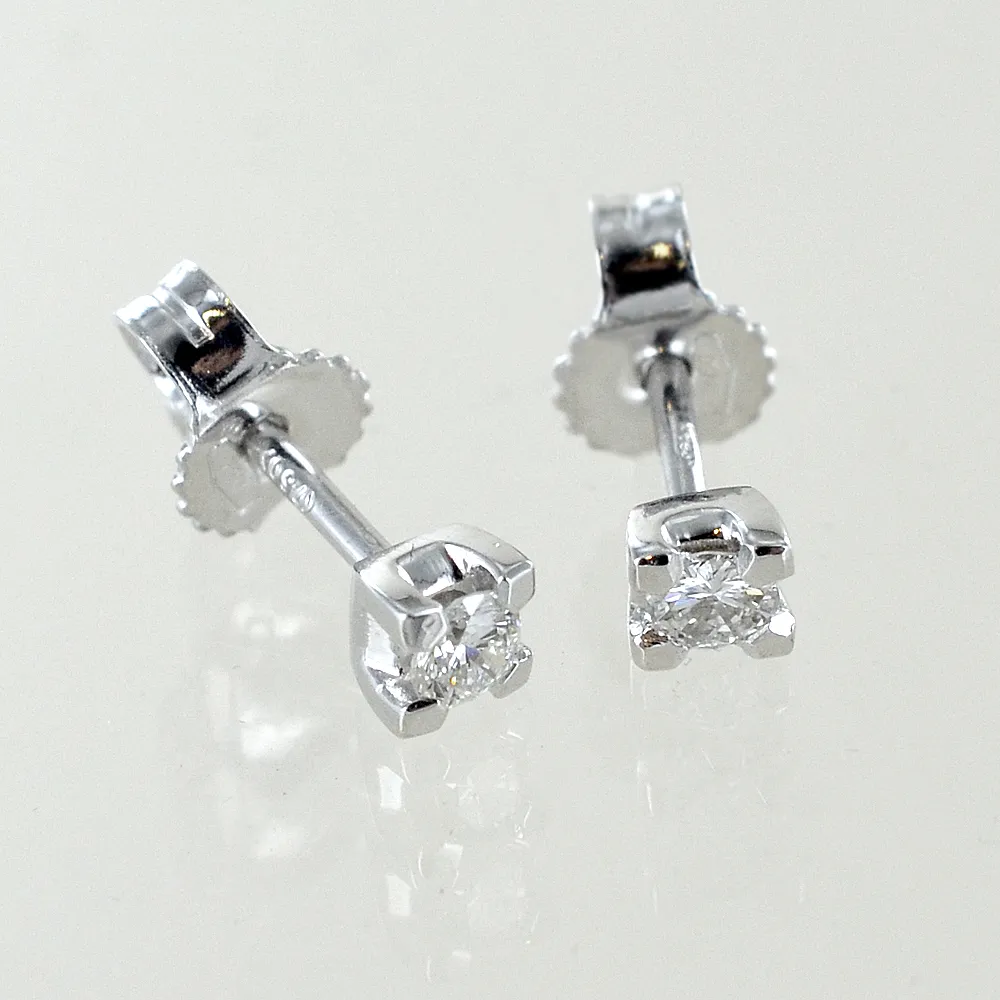 Orecchini punto luce piccoli in oro bianco e diamanti ct. 0.10 G VS1